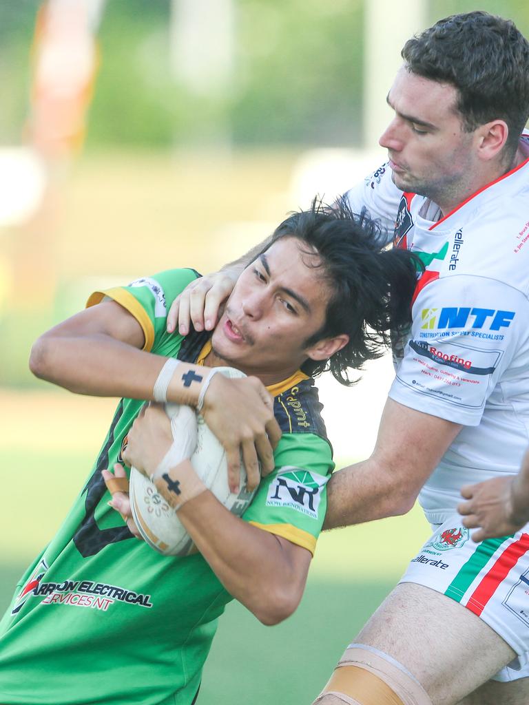 Palmerston’s Beau Latham caught in a tackle in the NRL NT A-Grade match between Nightcliff Dragons and Palmerston Raiders. Picture: Glenn Campbell