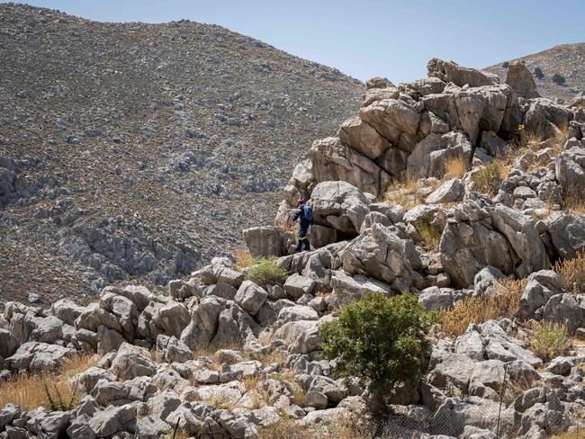 The TV doctor took a rocky mountain route in searing heat. Picture: AFP