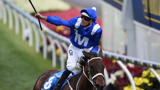 Hugh Bowman rides Winx to victory in the Cox Plate. Picture: AAP