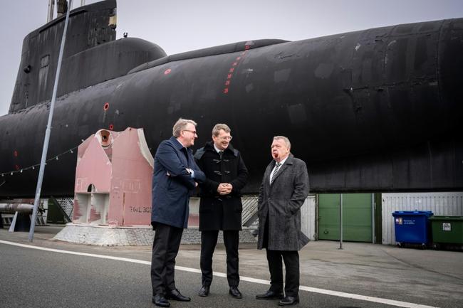 Denmark's Minister Denmark's Minister of Foreign Affairs Lars Lokke Rasmussen (right) standing next to a submarine in Copenhagen