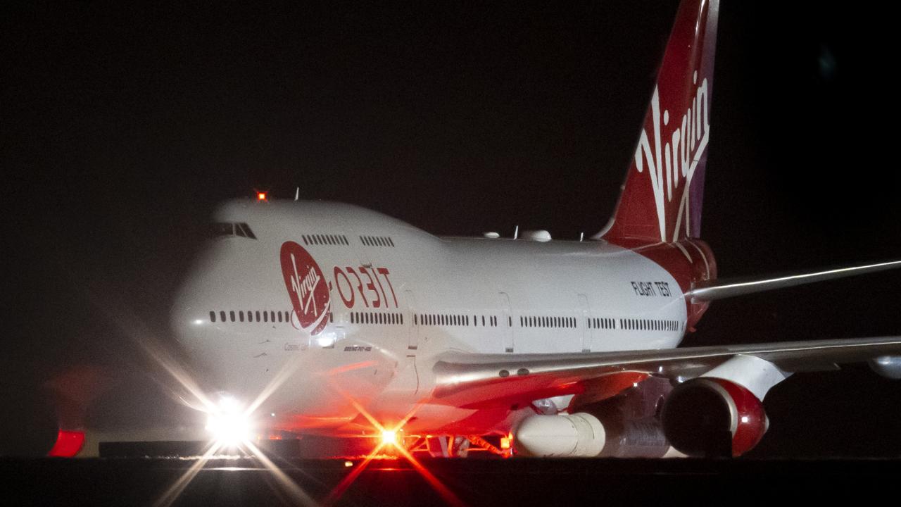 NEWQUAY, ENGLAND – JANUARY 09: A general view of Cosmic Girl, a repurposed Boeing 747 aircraft carrying the LauncherOne rocket under its left wing, as final preparations are made at Cornwall Airport Newquay on January 9, 2023 in Newquay, United Kingdom. (Photo by Matthew Horwood/Getty Images)