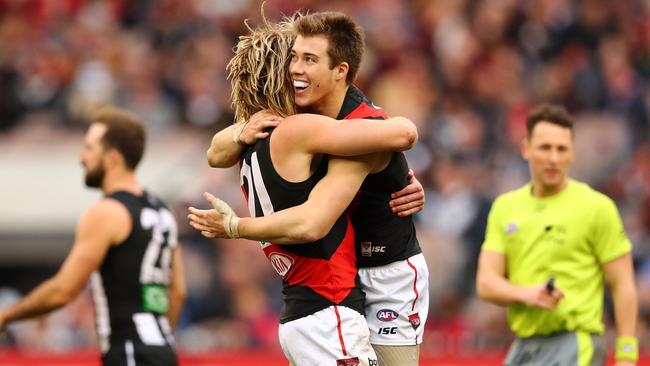 Essendon players celebrate victory over Collingwood.