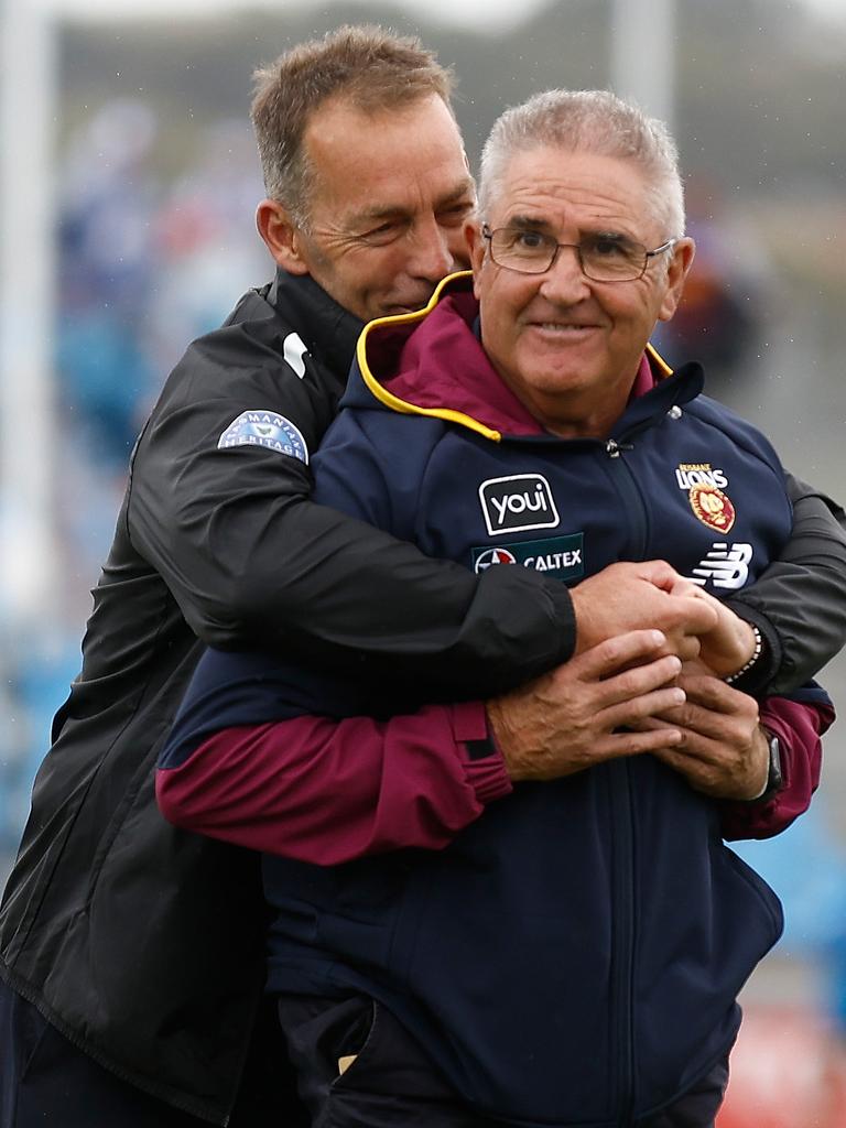 Alastair Clarkson and Chris Fagan share a lighter moment before their teams met earlier this year.