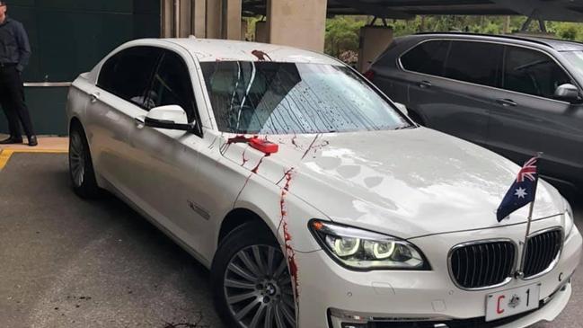 Protesters pelted the Prime Minister’s car with paint as he was escorted from the campus.