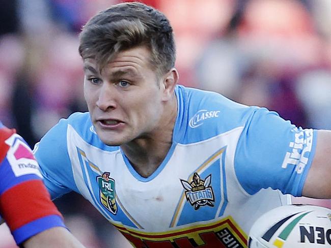 Jai Arrow of the Titans is tackled by Aidan Guerra  during the Round 19 NRL match between the Newcastle Knights and the Gold Coast Titans at McDonald Jones Stadium in Newcastle, Saturday, July 21, 2018. (AAP Image/Darren Pateman) NO ARCHIVING, EDITORIAL USE ONLY