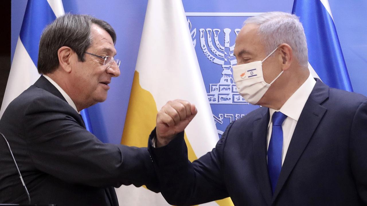 Israeli Prime Minister Benjamin Netanyahu (right) elbow-bumps Cyprus’ President Nicos Anastasiades after a meeting. Picture: Marc Israel Sellem/AFP