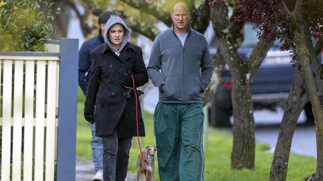 Optus chief executive Kelly Bayer Rosmarin with her husband, Rodney Rosmarin, in Bowral at the weekend, shadowed by a bodyguard. Picture: Liam Mendes