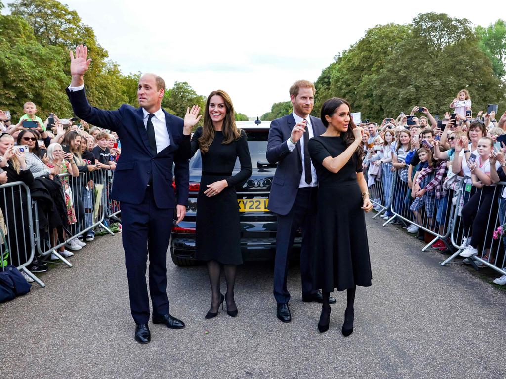 The quartet waved and smiled to the waiting crowds. Picture: AFP.