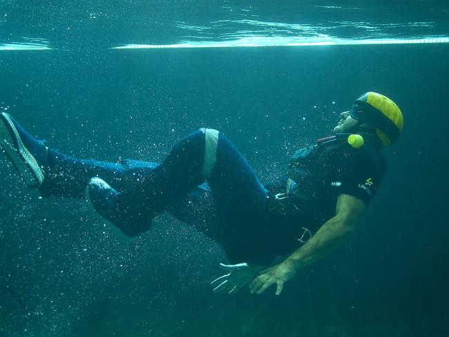 A LifeFlight doctor doing underwater training.