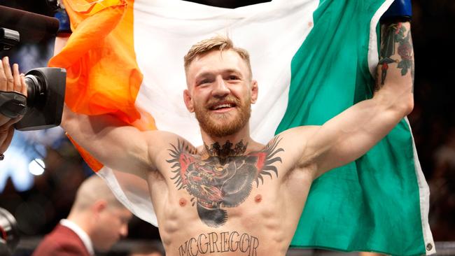 Conor McGregor celebrates after defeating Jose Aldo in a first-round knockout. Picture: Getty Images