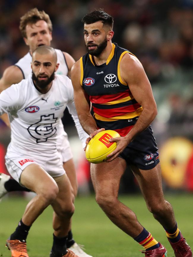 Wayne Milera of the Crows and Adam Saad of the Blues during the 2022 AFL Round 20 match between the Adelaide Crows and the Carlton Blues at the Adelaide Oval on July 30, 2022 in Adelaide, Australia. (Photo by Sarah Reed/AFL Photos via Getty Images)