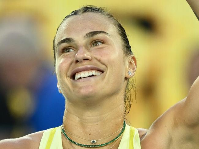 MELBOURNE, AUSTRALIA - JANUARY 12: Aryna Sabalenka celebrates winning match point against Sloane Stephens of the United States in the Women's Singles First Round match during day one of the 2025 Australian Open at Melbourne Park on January 12, 2025 in Melbourne, Australia. (Photo by Quinn Rooney/Getty Images)