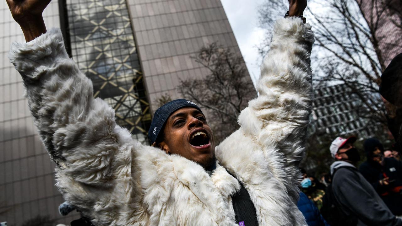 A man celebrates as the verdict is announced. Picture: Chandan Khanna / AFP