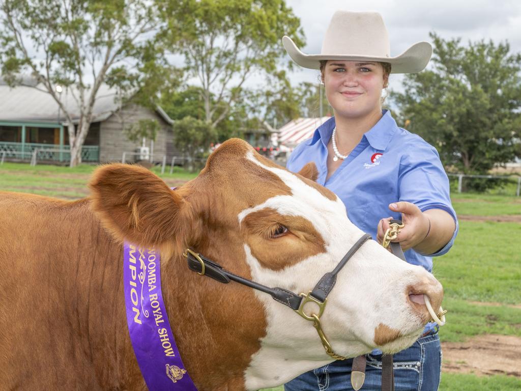 Lilly Wingfield with Trinity Vale Rebel Jaxon winner of 1st Junior Champion Simmental at the Toowoomba Royal Show. Saturday, March 26, 2022. Picture: Nev Madsen.