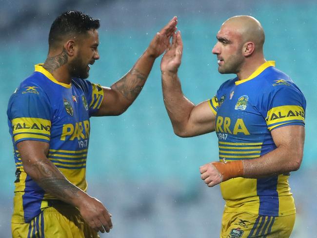 Kenny Edwards and Tim Mannah celebrate winning a game.