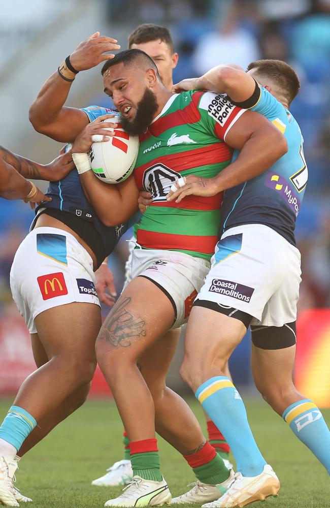 GOLD COAST, AUSTRALIA - JUNE 08: Keaon Koloamatangi of the Rabbitohs is tackled during the round 14 NRL match between Gold Coast Titans and South Sydney Rabbitohs at Cbus Super Stadium, on June 08, 2024, in Gold Coast, Australia. (Photo by Chris Hyde/Getty Images)