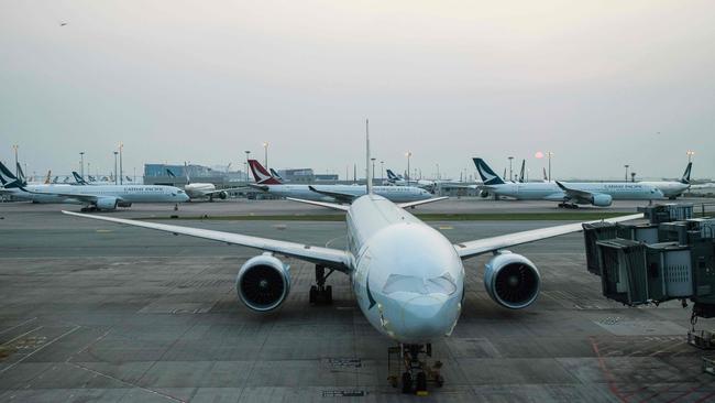 Cathay Pacific and Cathay Dragon passenger jets parked on the tarmac at Hong Kong International Airport. Picture: AFP