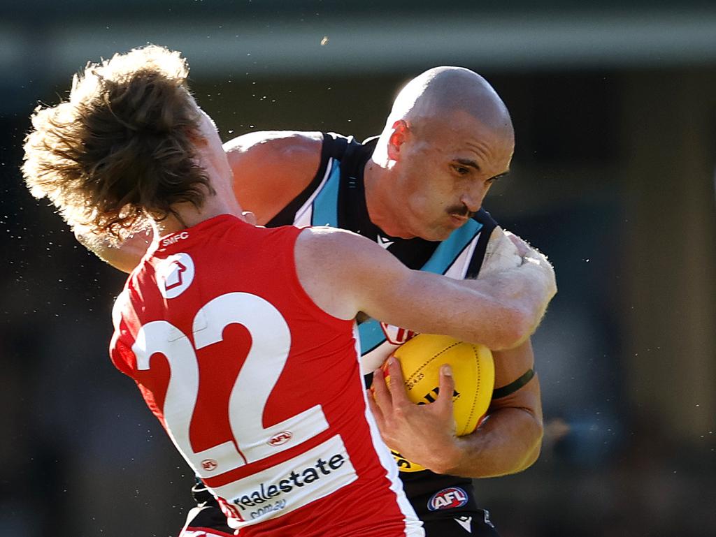 Sam Powell-Pepper is caught holding the ball by Nick Blakey.