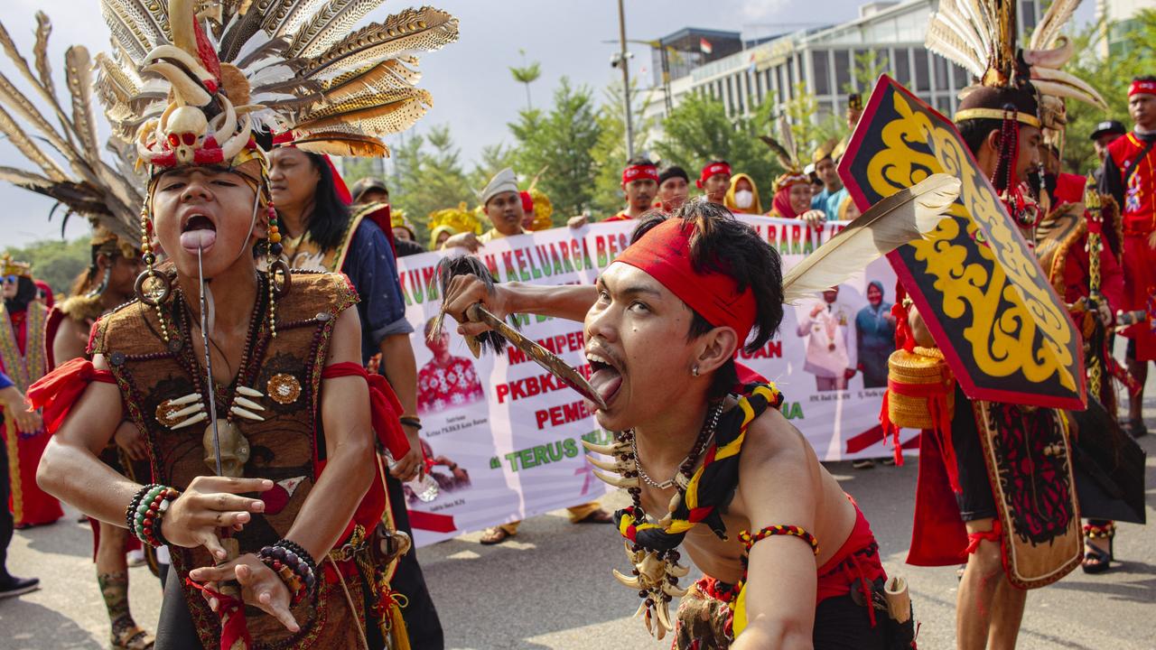 A number of participants from the West Kalimantan family association performed the saber dance while participating in the Nusantara Cultural Parade in Batam, Riau Islands, Indonesia. Photo: Teguh Prihatna/NurPhoto