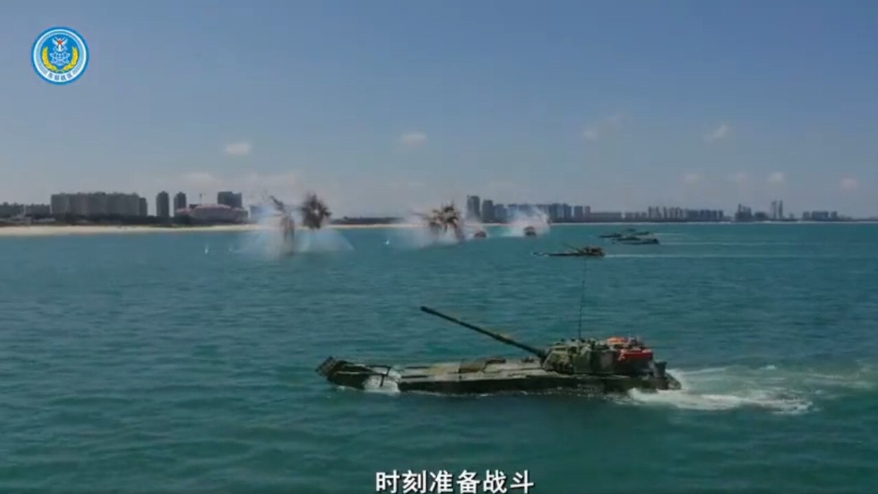 China released video footage of a full-scale amphibious assault showing its army, navy and airforce in a simulated invasion, a day before the expected arrival of a US diplomatic visit to Taiwan.