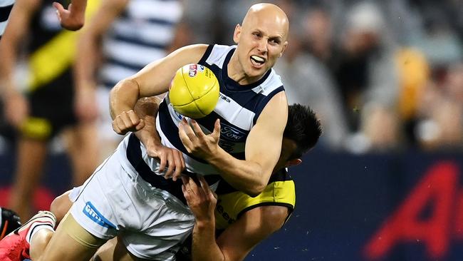 Gary Ablett came up smarting from this first-quarter tackle from Richmond captain Trent Cotchin. Picture: Getty Images