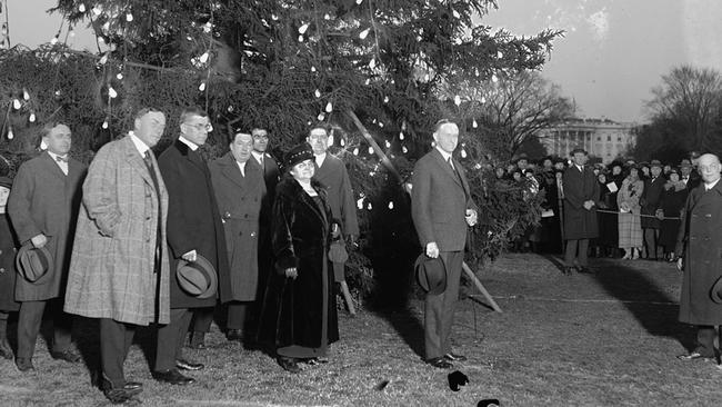 US president Calvin Coolidge at the inaugural lighting of the White House Christmas tree on December 24, 1923.