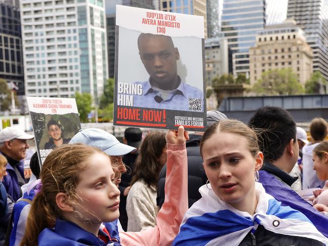 Jewish Australians hold signs demanding the return of hostages. Picture: Ian Currie