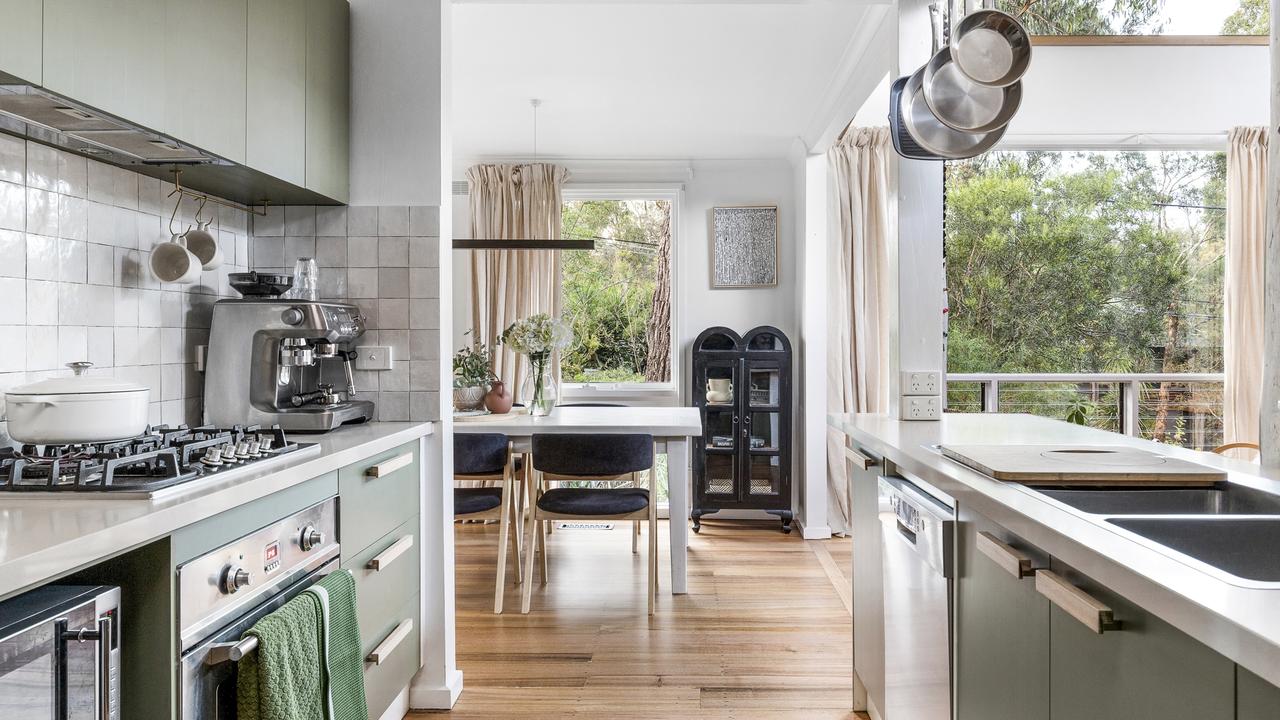 The kitchen looks out onto your yard.