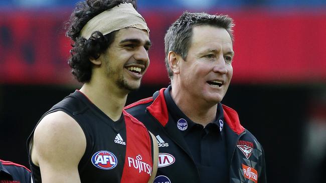 Essendon coach John Worsfold with Jake Long after the game. Picture: George Salpigtidis