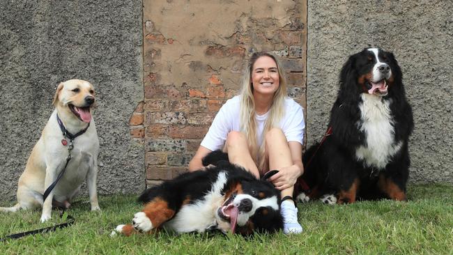 Caitlin Bassett, with dogs Chino, Giulio and Andre, is ready to take a break