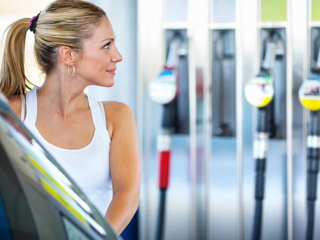 A woman filling up her car with petrol. Picture: iStock.