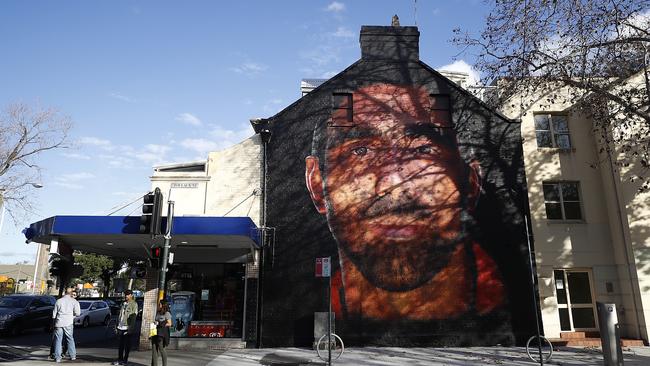 A mural of former Sydney Swans player Adam Goodes has been painted on the wall of a building in Surry Hills, Sydney. Picture: Getty Images