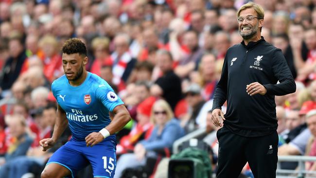 Jurgen Klopp, Manager of Liverpool reacts as Alex Oxlade-Chamberlain of Arsenal controls the ball.