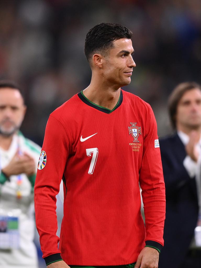 HAMBURG, GERMANY - JULY 05: Cristiano Ronaldo of Portugal looks dejected following the team's defeat in the penalty shoot out during the UEFA EURO 2024 quarter-final match between Portugal and France at Volksparkstadion on July 05, 2024 in Hamburg, Germany. (Photo by Justin Setterfield/Getty Images)