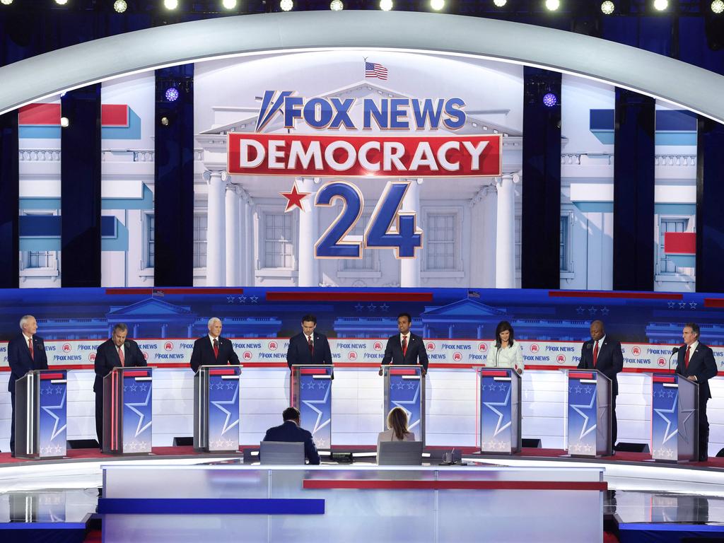 Republican presidential candidates (L-R), Asa Hutchinson, Chris Christie, former US Vice President Mike Pence, Ron DeSantis, Vivek Ramaswamy, Nikki Haley, Tim Scott and Doug Burgum take the stage for the first debate of the GOP primary season hosted by Fox News on August 23, 2023 in Milwaukee. (Photo by WIN MCNAMEE / GETTY IMAGES NORTH AMERICA / Getty Images via AFP)