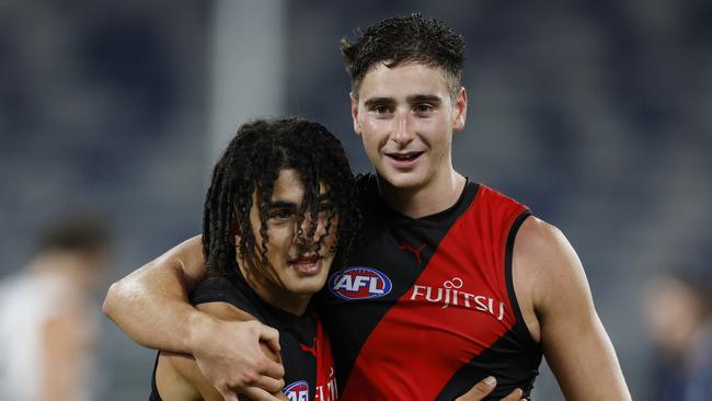 NCA. MELBOURNE, AUSTRALIA. 25th February, 2025 . AFL.  AAMI Community Series. Geelong vs Essendon at GMHBA Stadium.   Isaac Kako hugs Elijah Tsatas after tonights win over Geelong  .  Picture: Michael Klein