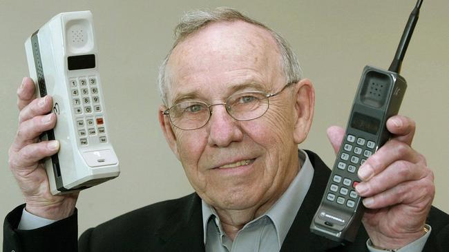 Former Motorola design chief Rudy Krolopp with the world’s first mobile phone, the DynaTAC 8000X (left), and the first GSM mobile phone for Europe, 'International 3200' (right). Picture: Christof Stache.