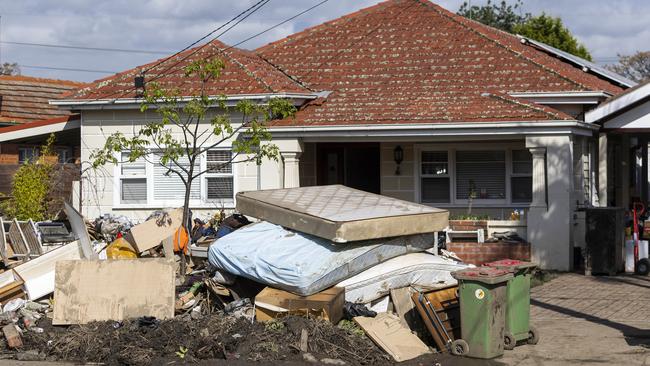 Flood-damaged furniture lines a Maribyrnong street after the flooding. Picture: Aaron Francis