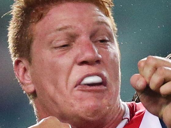 SYDNEY, AUSTRALIA - MARCH 28: Dylan Napa of the Roosters is tackled during the round four NRL match between the Sydney Roosters and the Manly-Warringah Sea Eagles at Allianz Stadium on March 28, 2014 in Sydney, Australia. (Photo by Matt King/Getty Images)