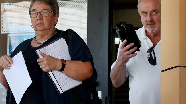 Edith van Dommelen, 68, and Lawrence Gordon Petersen, 63, leaving the Richlands Magistrates Court after being charged with fraud and failing to comply with border directions. Picture: Tara Croser.