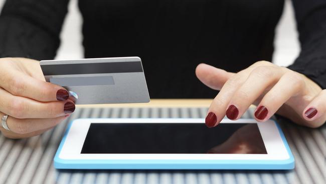 Generic photo of a woman entering card details on a tablet. Picture: Supplied.