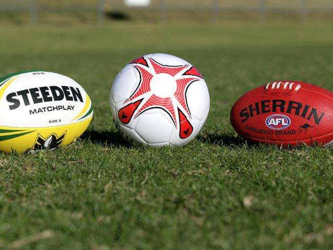 Generic football shots. Steeden Rugby League NRL football, soccer ball and Sherrin AFL football. sport / balls