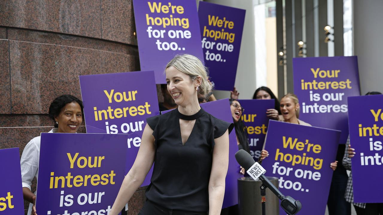 Samantha Harvey speaks with her fellow Aussie Mortgage Brokers who staged a short protest march to the RBA headquarters in anticipation of a possible long-awaited interest rate cut announcement this afternoon. Picture: NewsWire / John Appleyard