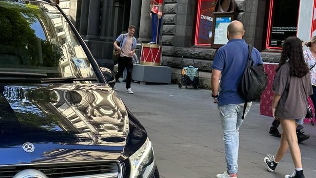 A private-hire Mercedes parked on the footpath on Swanston St on December 8, 2022