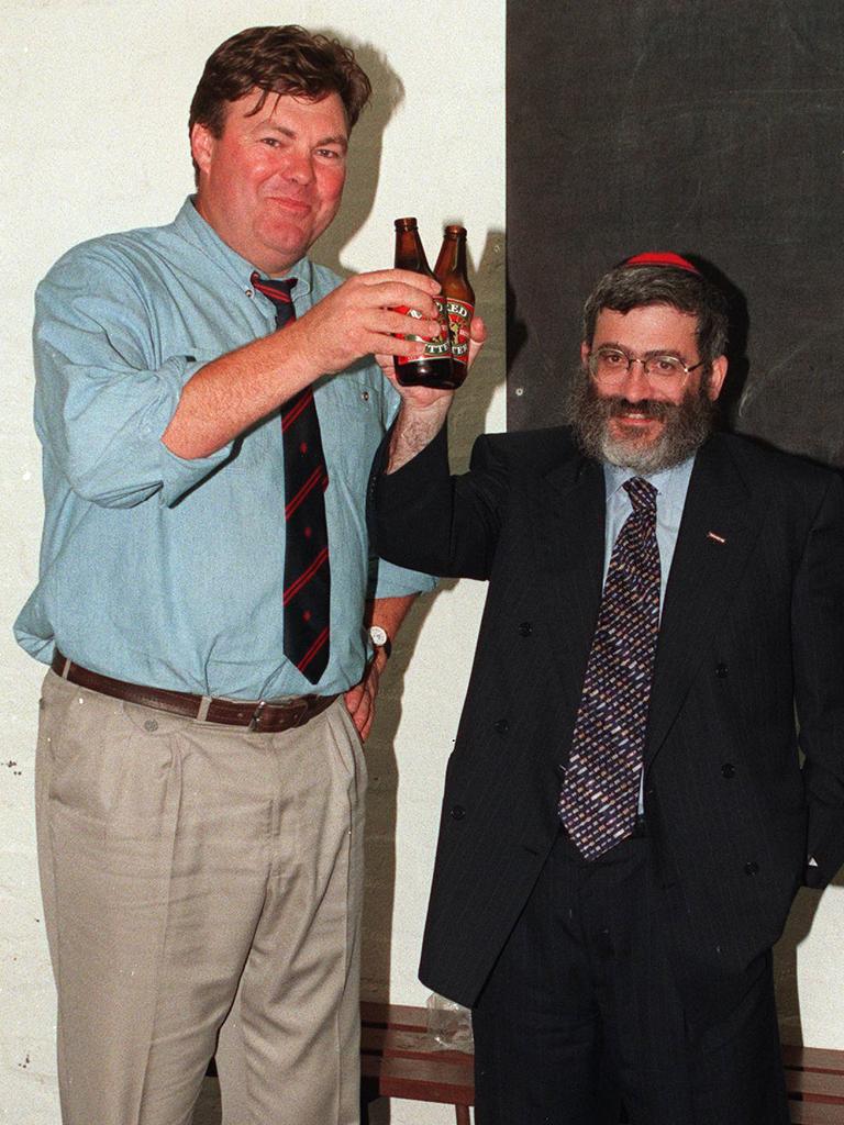 Neil Balme and Joe Gutnick celebrate a win with a beer.