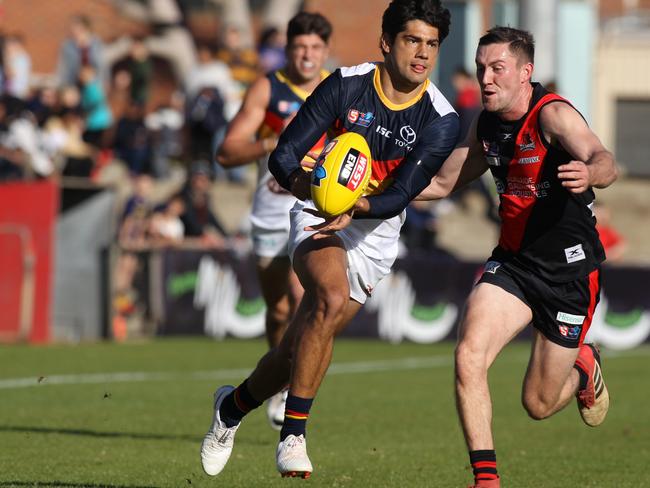 SANFL: West Adelaide v Adelaide at Richmond Oval. Adelaide's Shane McAdam breaks away from West's Jack Evans. 8 June 2019. (AAP Image/Dean Martin)