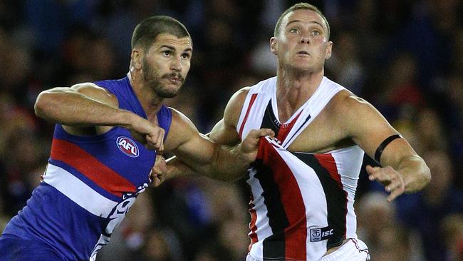 Koby Stevens battles David Armitage for the ball. Picture: George Salpigtidis