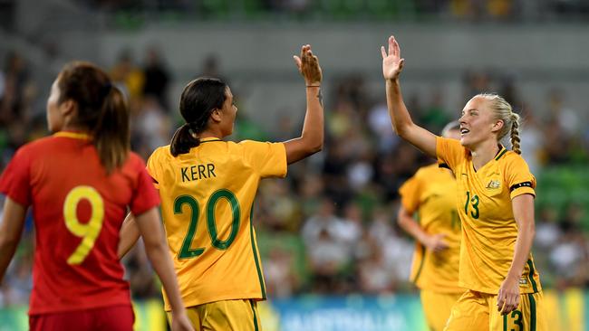 Sam Kerr of the Matildas congratulates Tameka Butt of the Matildas (right) after she scores a goal during the first of two matches in an International Series between the Matildas and China PR at Melbourne Rectangular Stadium, commercially known as AAMI Park, in Melbourne, Wednesday, November 22, 2017. (AAP Image/Joe Castro) NO ARCHIVING, EDITORIAL USE ONLY