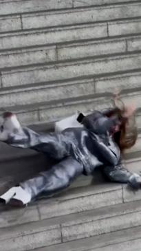 Model takes a tumble in $2,500 outfit