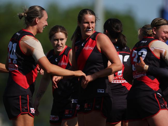 Ellyse Gamble of the Bombers celebrates kicking a goal at Windy Hill on Friday. Picture: Daniel Pockett/Getty Images.